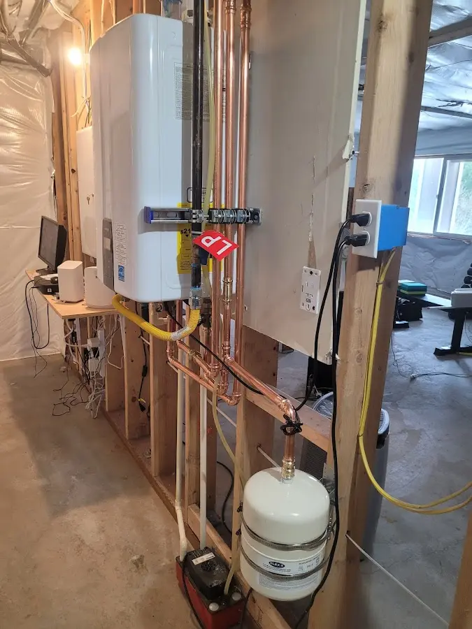 Licensed plumber repairing a kitchen sink in Kenai